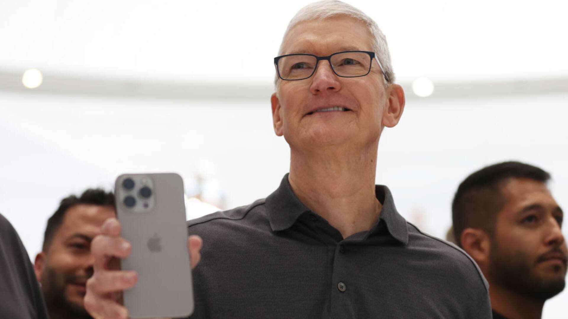 Apple CEO Tim Cook holds up a new iPhone 15 Pro during an Apple event on Sept. 12, 2023 in Cupertino, Calif.