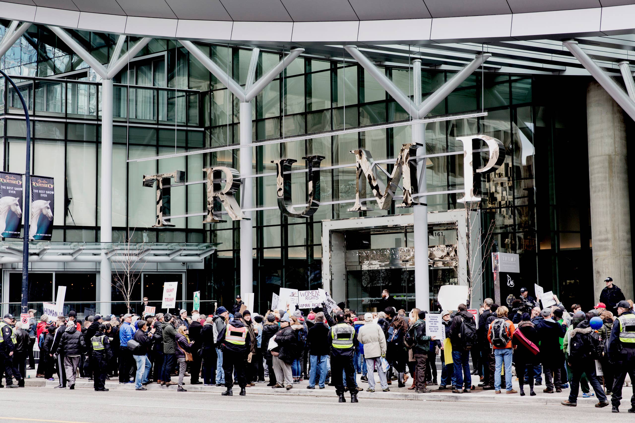 Protesters demonstrate in front of the Trump International Hotel and Tower in Vancouver during the hotel's opening day on February 28, 2017.