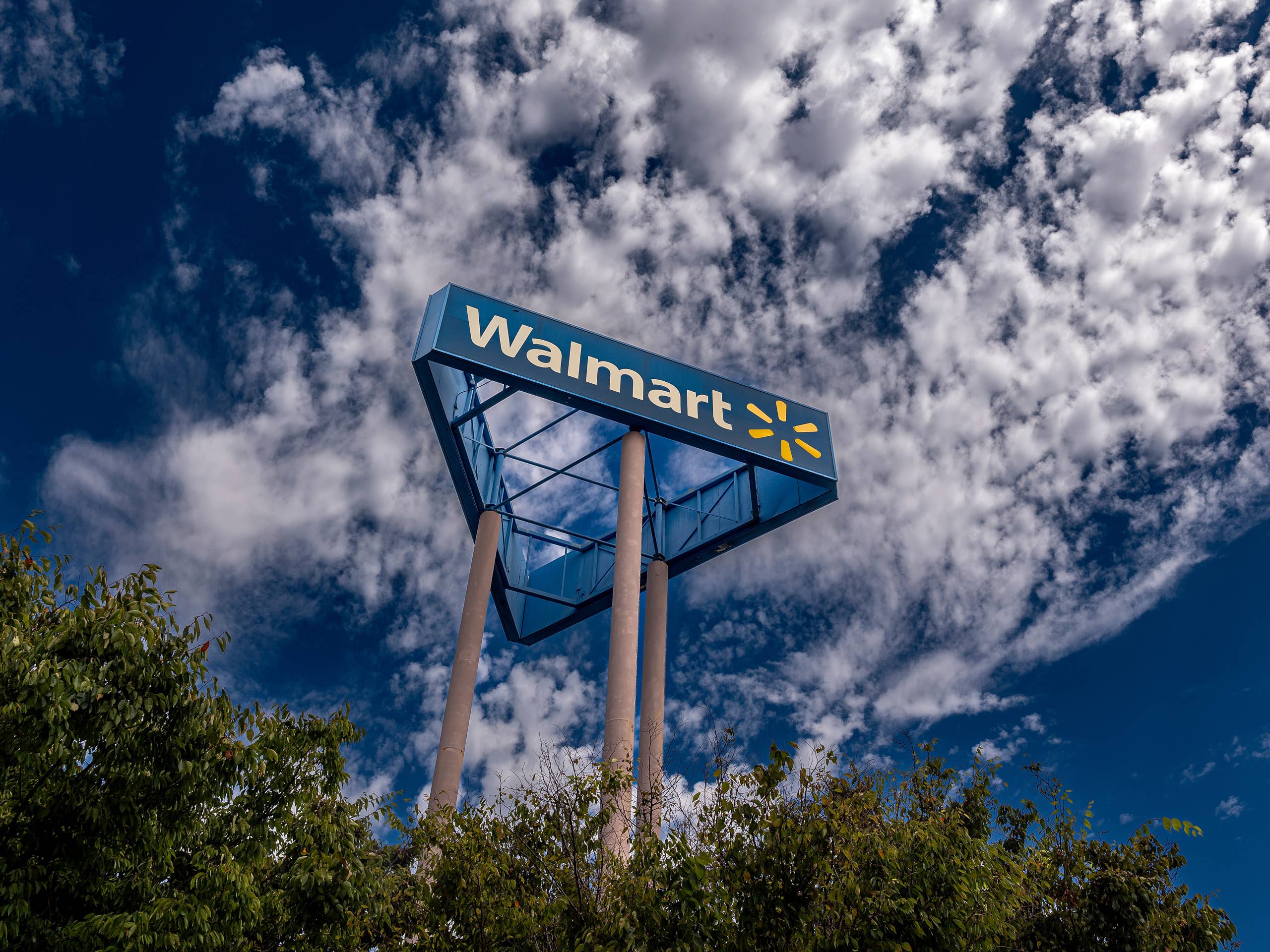 A sign outside a Walmart store in San Leandro, California, U.S., on Monday, Aug. 14, 2023. Walmart Inc. is expected to release earnings figures on August 17. Photographer: David Paul Morris/Bloomberg via Getty Images
