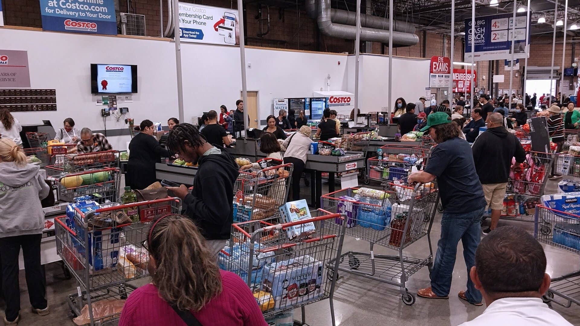 People wait to check out at Costco.