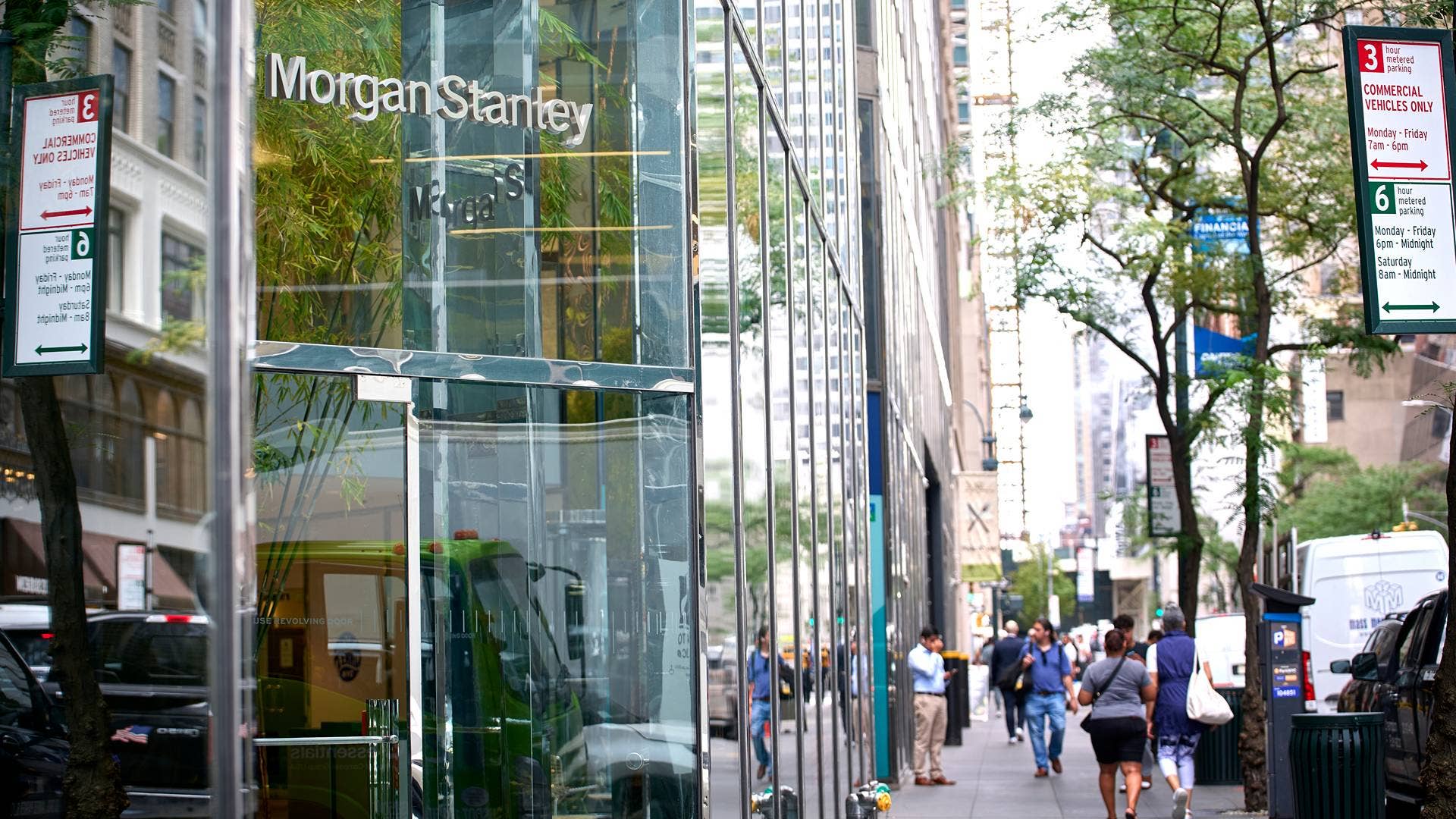 People walk past Morgan Stanley building