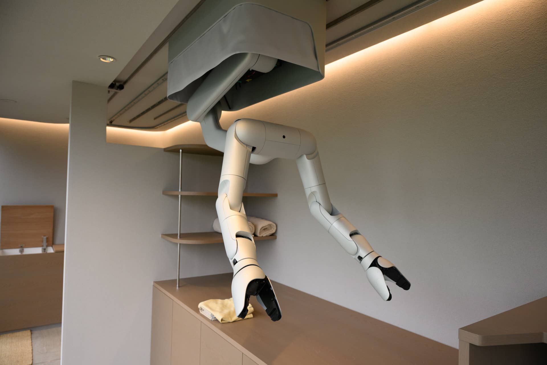 MW Inc. robotic arms move along ceiling-mounted rails during a demonstration inside a prototype home in Tokyo, Japan, on Thursday, Sept. 10, 2026. Tokyo-based startup MW is offering homes with built-in robotic housekeeping arms, a counter to a global embrace of humanoids. Photographer: Akio Kon/Bloomberg via Getty Images