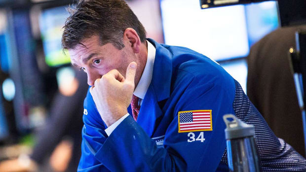 Stocks Hit New Lows After Early Rally as Fed Hikes Key Rate