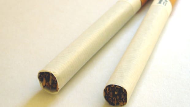 Philip Morris Cuts Earnings Forecast, Acquires E-Cigarettes Maker