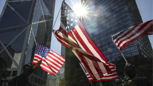 Anti-government protesters wave American flags at a rally in Central on December 1 to thank the US government for passing the Hong Kong Human Rights and Democracy Act. Photo: Winson Wong