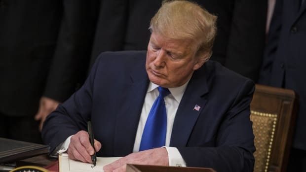 US President Donald Trump signed the deal at the White House. Photo: Bloomberg