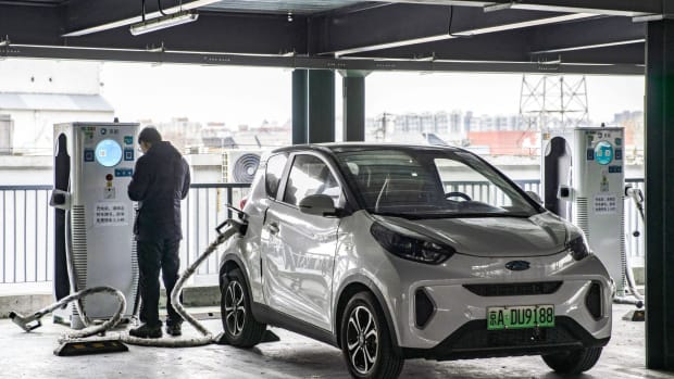 A person charges his vehicle at a Beijing Jingneng Clean Energy charging station in Beijing. Photo: Bloomberg