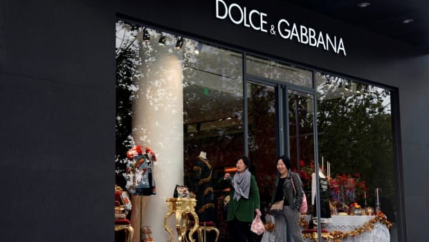 People walk past a Dolce & Gabbana store in Shanghai. Photo: Reuters