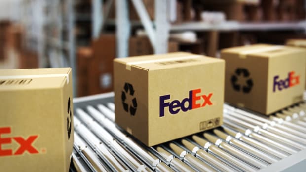Packages are seen at a Fedex warehouse. Lead.