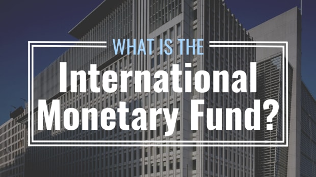 A darkened photo of the IMF headquarters in Washington, DC, with text overlay that reads "What Is the International Monetary Fund?"