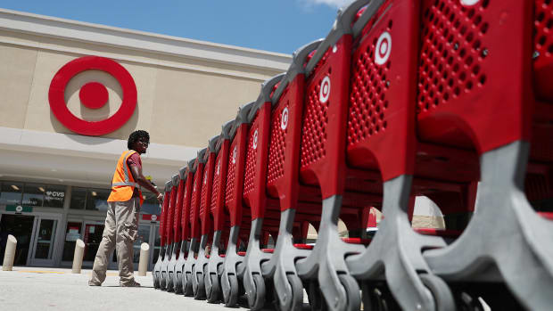 A Target Employee collects grocery carts. Lead.