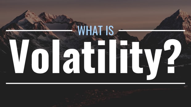 Darkened photo of a mountain range with text overlay that reads "What Is Volatility?"