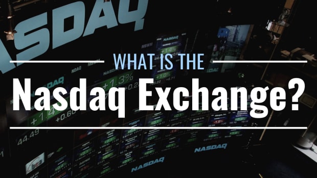 Darkened photo of a screen displaying the Nasdaq logo and various stock tickers and prices with text overlay that reads "What Is the Nasdaq Exchange?"