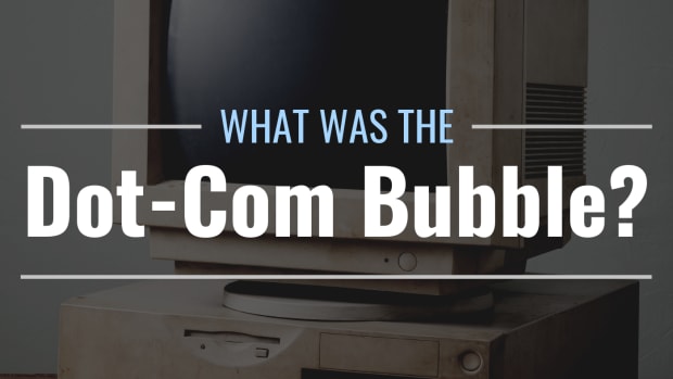 Darkened photo of an old, beige desktop computer on a desk with stylized text overlay that reads "What Was the Dot-Com Bubble?"