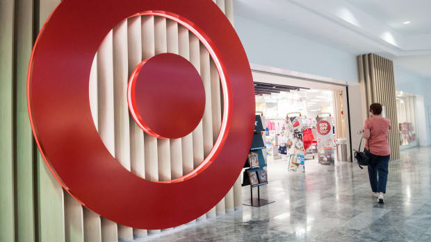 A woman walks into a Target. Target Lead