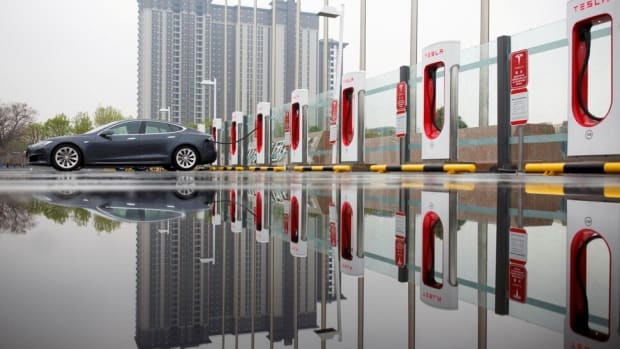 A Tesla electric car at a charging point in Beijing. Photo: Reuters
