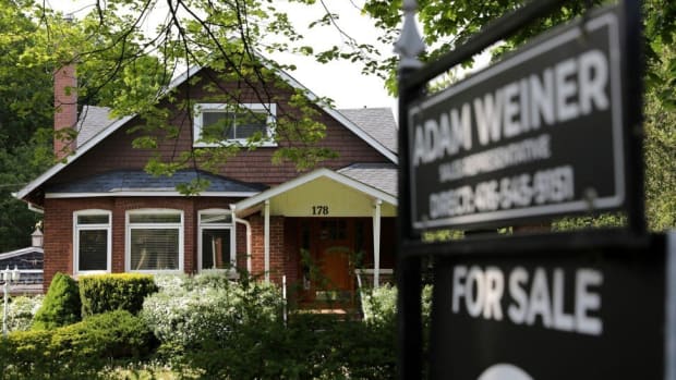 A realtor's sign outside a house for sale in Toronto on May 20, 2021. Photo: Reuters.