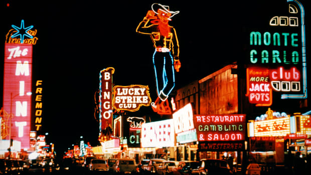 A number of downtown Las Vegas casinos are seen along with the Las Vegas neon cowboy.