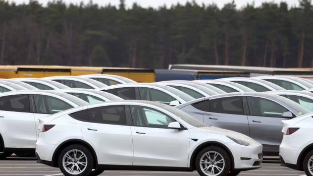 Many Tesla Model Y EVs sit on a lot. Lead KL.