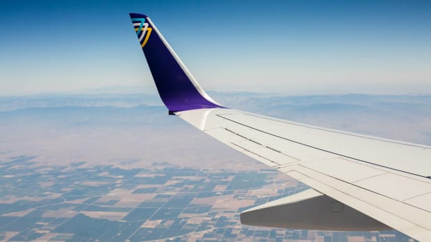 An Avelo Airlines airplane is seen flying above land. -lead