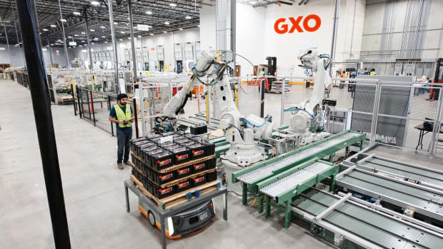 2021-02-GXO-SC-Employee-operating-Robot-Arm-scaled