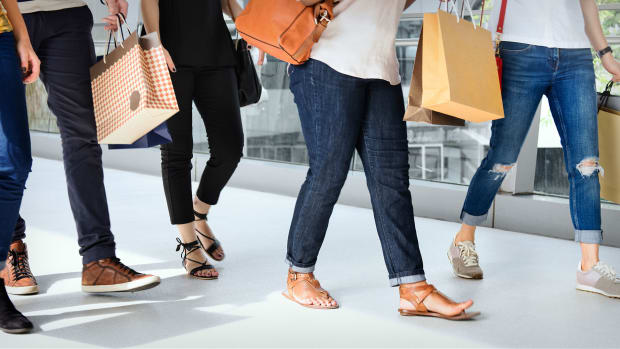 People walk with shopping bags. Lead.