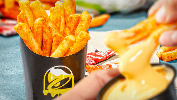 Taco Bell Nacho Fries are pictured with their cheese dipping sauce. Lead JS 101122