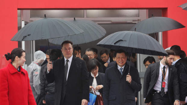 Tesla boss Elon Musk (L) walks with Shanghai Mayor Ying Yong during the ground-breaking ceremony for a Tesla factory in Shanghai on January 7, 2019. - Musk presided over the ground-breaking for a Shanghai factory that will allow the electric-car manufacturer to dodge the China-US tariff crossfire and sell directly to the world's biggest market for "green" vehicles. (Photo by STR / AFP) / China OUT        (Photo credit should read STR/AFP via Getty Images)
