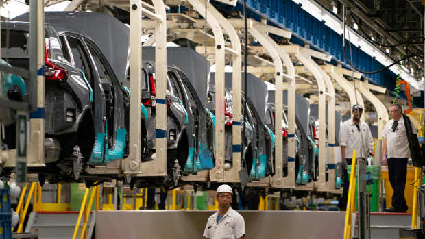 Workers continue vehicle assembly shortly before the line was shut down for an event at the Honda of Canada Manufacturing Plant 2 in Alliston, Ontario, on April 25, 2024 where it was announced that Japanese automaker Honda will make the largest automotive investment in Canada's history worth Can$15 billion (US$11 billion) electric vehicle investment in Ontario that will see four new manufacturing plants built in the province. (Photo by Peter POWER / AFP) (Photo by PETER POWER/AFP via Getty Images)
