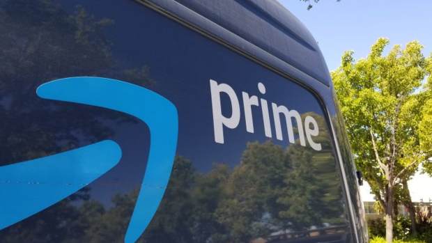 Close-up of logo for Amazon Prime service on the side of a branded delivery truck in San Ramon, California.