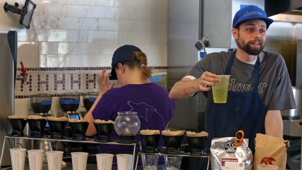 CAMBRIDGE, MA - JUNE 16: Ethan Siegel serves a drink at Clover Food Lab in Cambridge, Mass., on June 16, 2016. Clover Food Lab had invested $100,000 a year in buying compostable tableware and having local company, Save That Stuff, to haul away all of his compost each week. Muir was furious to learn that for the last few months, his compost was going to the trash heap. (Photo by David L. Ryan/The Boston Globe via Getty Images)