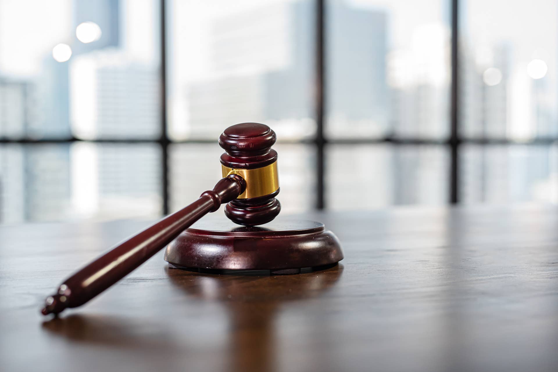 judge-hammer-on-an-old-desk-2022-10-03-21-49-02-utc
