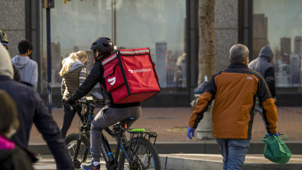 A bike messenger carries a DoorDash Inc. bag in San Francisco, California, U.S., on Wednesday, Dec. 23, 2020. Bloomberg is scheduled to release consumer comfort figures on December 24. Photographer: David Paul Morris/Bloomberg via Getty Images
