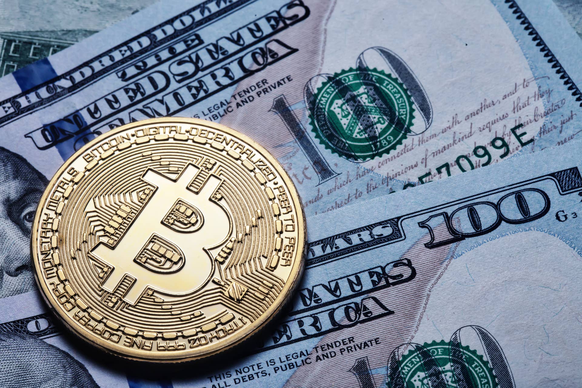 gold-bitcoin-on-hundred-dollar-bills-2023-11-27-05-31-06-utc