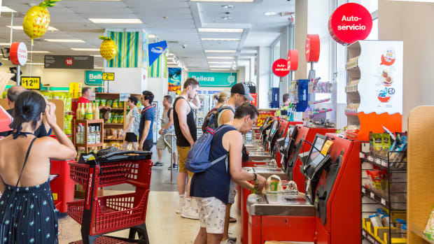 Customers are seen using self checkout machines at a CVS drug store in Old San Juan, Puerto Rico.