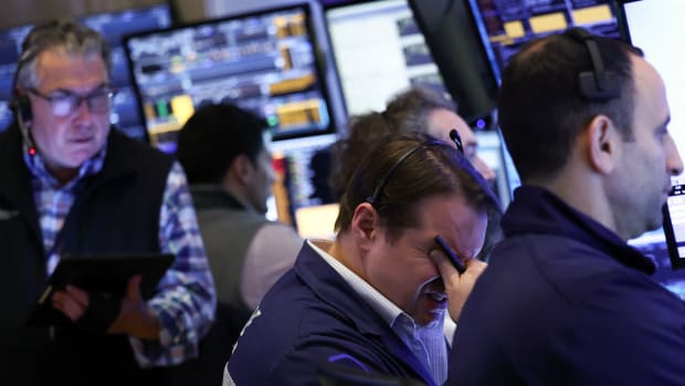 Traders work on the floor of the New York Stock Exchange.