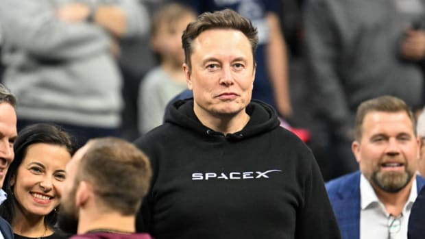Elon Musk attends the NCAA Division 1 wrestling national championship finals. Lead.