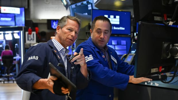 Traders work on the floor of the New York Stock Exchange.