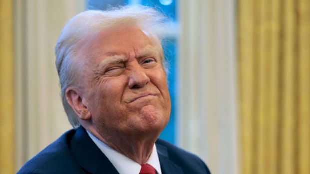 President Donald Trump with a pained expression on his face. lead.