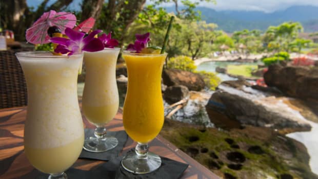 Pina coladas garnished with flowers. lead.