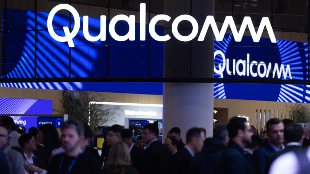 BARCELONA, SPAIN - MARCH 06: A logo sits illuminated at the Qualcomm booth at Mobile Congress 2025 on March 06, 2025 in Barcelona, Spain. The Mobile World Congress 2025 has seen its best attendance figures since the pandemic, with around 109,000 attendees. Artificial Intelligence was the most important topic during the congress, with 2,900 exhibiting companies, in addition to new developments and technological innovations. (Photo by Eric Alonso/Getty Images)