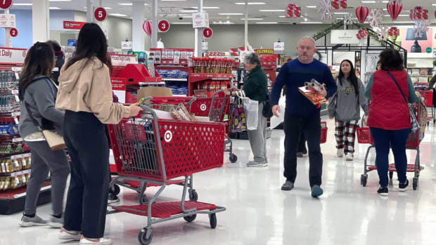 Customers shop at a Target store on Dec. 14, 2023 in Daly City, Calif. Lead.