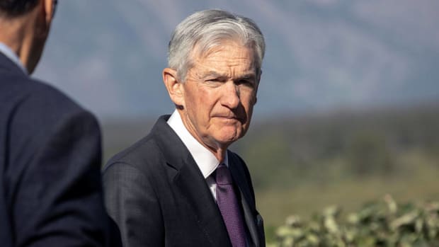Federal Reserve Chairman Jerome Powell walks with other bankers near Jackson Hole, Wyoming, during the 2025 annual Jackson Economic Symposium. lead.