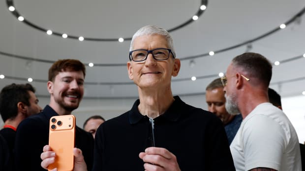 CUPERTINO, CALIFORNIA - SEPTEMBER 09: Apple CEO Tim Cook holds a next generation iPhone 17 during an Apple special event at Apple headquarters on September 09, 2025 in Cupertino, California. Apple unveiled a new generation of iPhones and updated Apple Watches and AirPods during a special event at Apple headquarters. (Photo by Justin Sullivan/Getty Images)
