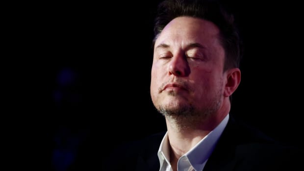 Tesla CEO Elon Musk with eyes closed. lead.