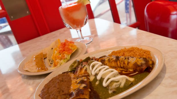 A mexican dinner on a table in a restaurant.