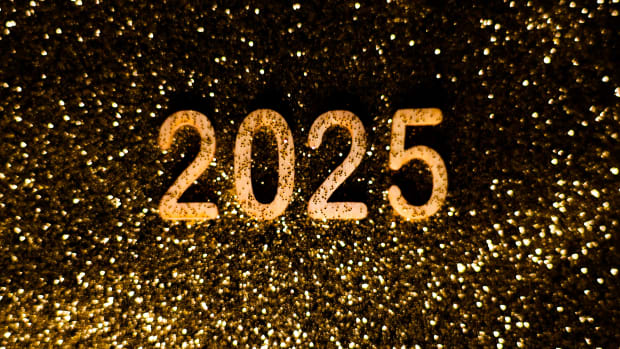Happy New Year 2025 wooden numbers are photographed on a golden glitter for illustration photo. Krakow, Poland on December 30, 2024. (Photo by Beata Zawrzel/NurPhoto via Getty Images)