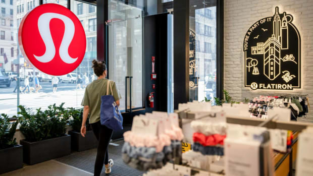 A customer exits a Lululemon store. lead.