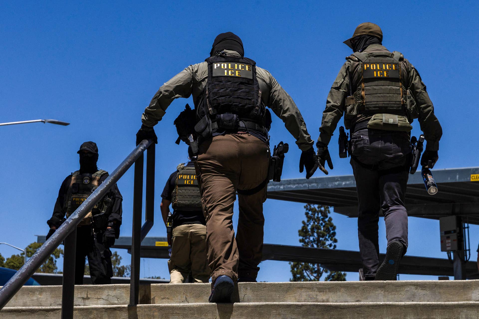 Immigration and Customs Enforcement (ICE) agents walk outside the Ventura County Government Center in Ventura, California, on July 27, 2026.