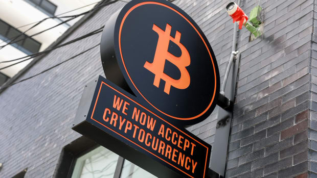 A Bitcoin sign is displayed on the wall of developers Ciprés and Rilea Group, who have sold a condominium unit in the Rider Residences, an under-construction project in Midtown Miami, using Bitcoin.